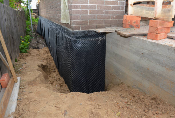SJ Waterproofing Pros technician performing targeted Exterior Waterproofing assessment in Adamsville, OH